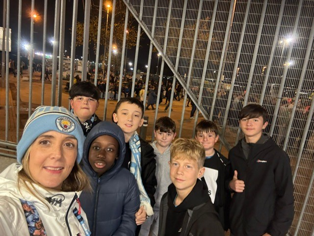 Students and staff at football match