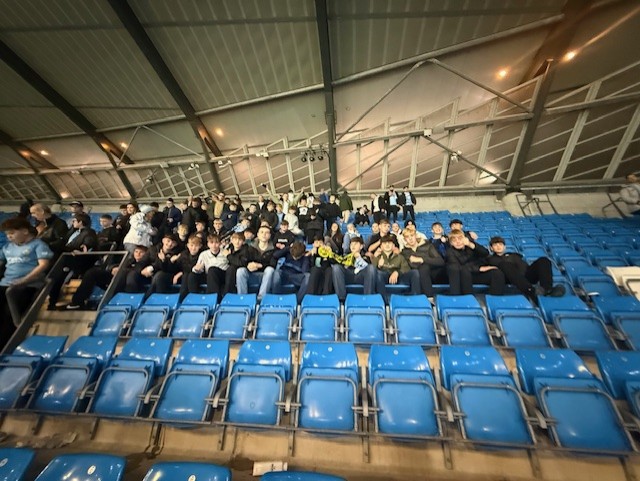 Students and staff at football match